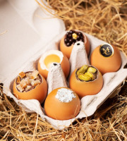 Compagnie Générale de Biscuiterie - Boite contenant 6 œufs en chocolat avec une présentation Coco, oranges confites, pistaches, Caviar